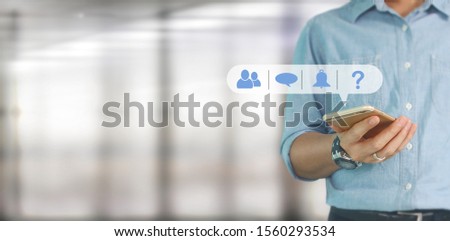 Man hand holding smartphone device and touching screen.business idea