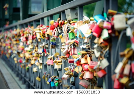 Thousands of love padlocks locked on the rail of Iron Bridge in Frankfurt Um Main.