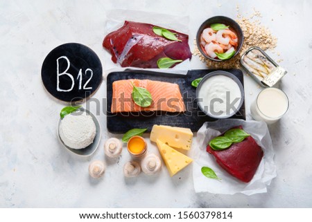 Natural sources of Vitamin B12 (Cobalamin) for normalization of sleep;  ensuring normal brain function; supporting the respiratory system;  alzheimer's deasease treatment. Top view  Royalty-Free Stock Photo #1560379814