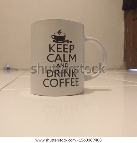 a cup coffee with the word "Keep Calm and Drink Coffee"