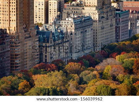 Afternoon light on Central Park's treetops and NYC buildings. Upper West Side building facades and tree colors lit by the autumn sun. Royalty-Free Stock Photo #156039962
