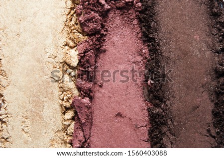 Texture of broken eyeshadow or powder. The concept of fashion and beauty industry. Close-up. - Image