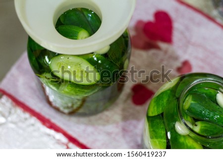 Pickles in jars for the winter. Preservation of vegetables. Environmentally friendly product. Delicious, green cucumbers. Selective focus. Lifestyle. The collection of vegetables. Canned food. 