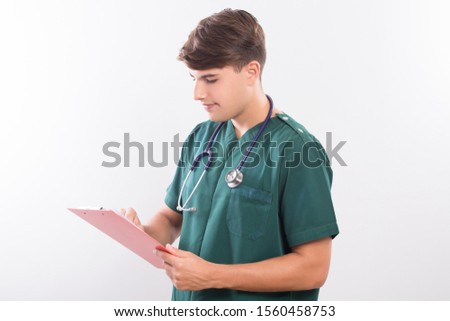 Portrait of surgeon standing and working in green scrubs and stethoscope work in hospital or clinic isolated on white background with copy space medicine concept.
