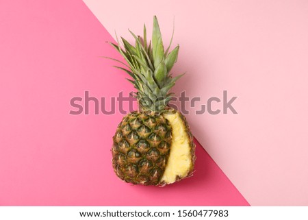 Pineapple on two tone background, space for text