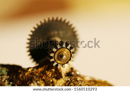 vintage non-ferrous gear against the background of the mineral pyrite