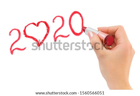 Hand with lipstick drawing 2020 isolated on white background