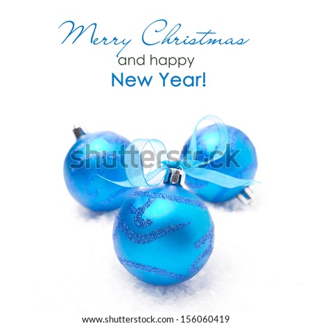 three blue Christmas balls, isolated on white background, close-up
