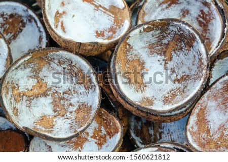 Textured background of brown coconuts,cracked coconuts,Coconut cut in half, Coconut shell.