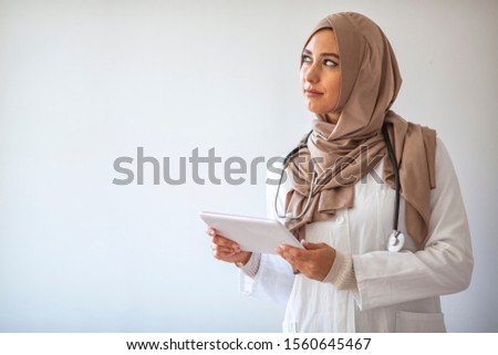 Portrait Of Smiling Muslim Doctor. Confident female nurse. Closeup portrait of friendly, smiling confident muslim female doctor. Arab female Doctor. Arab female nurse posing and smiling