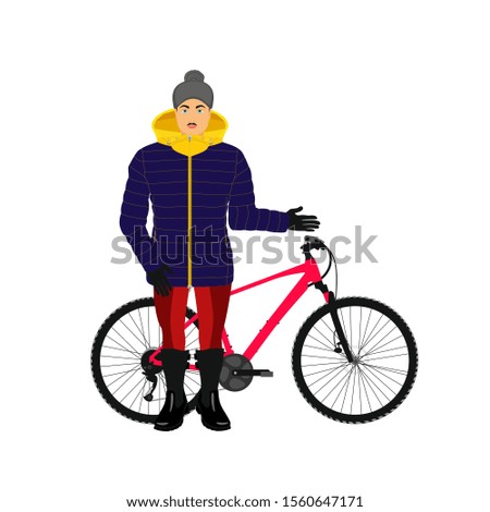 Man in winter clothes with a bicycle