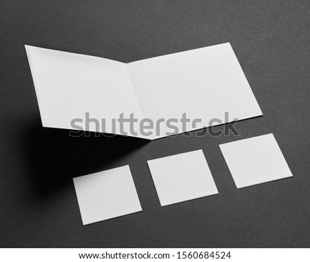 Mock-up of the two square business cards are on a black paper                  