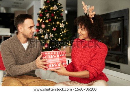 Man giving the big Christmas gift