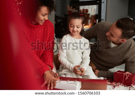 Family packing gifts for Christmas 