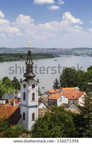 Photograph of panoramic view from Gardos - Zemun, with Saint Nicholas church baroque bell tower and river Danube. Zemun, Belgrade, Republic of Serbia.