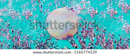 Colorful Sparkling Glitter confetti. Christmas Holidays abstract background, ispired by neo mint, color of 2020, holographic paper for your text, greeting card