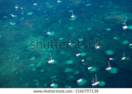 Aerial view of Pollensa, sailing boat anchored in the Pollensa Bay, Majorca, Balearic Island, Spain.