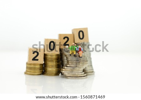 Miniature people, Old couple figure sitting on top of stack coins using as background retirement planning, Life insurance concept.
