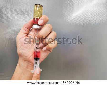 syringe, medical injection in hand, medicine plastic vaccination equipment with needle.Nurse or doctor. liquid drug or narcotic. health care in hospital.