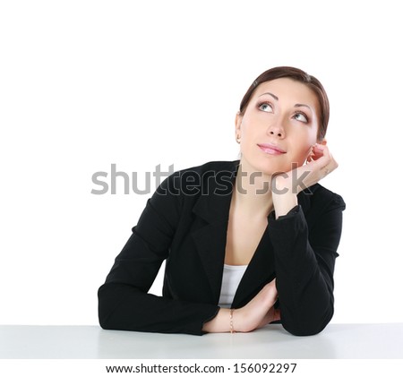 A young woman sitting at the desk, isolated on white background