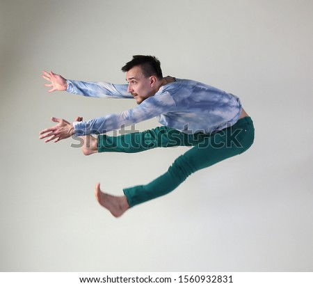 dancer dancing jumping on a white background in the studio