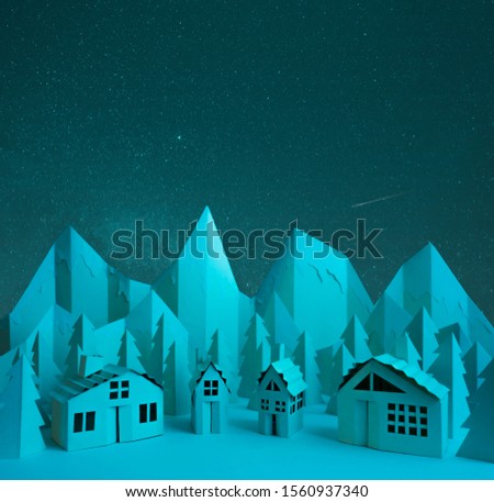 Paper landscape of a mountain village at night

