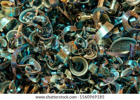 Metal shavings close-up multicolored, abstract background. Production waste..