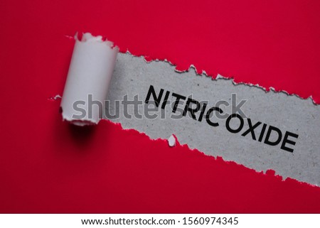 Nitric Oxide Text written in torn paper. Medical concept Royalty-Free Stock Photo #1560974345
