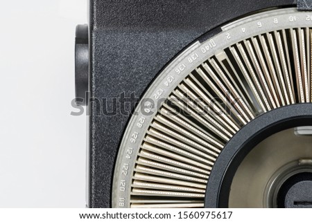 Photo slides and old projector with round tray with white background. 