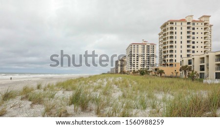 Sand dunes, sea oats and skylines on Jacksonville Beach as a cold front arrives bringing clouds and cooler weather.