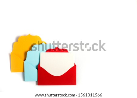Set of three envelopes yellow, red and blue sealed, empty and with clean paper inside, isolated on a white background. Communication, newsletter and business concept.