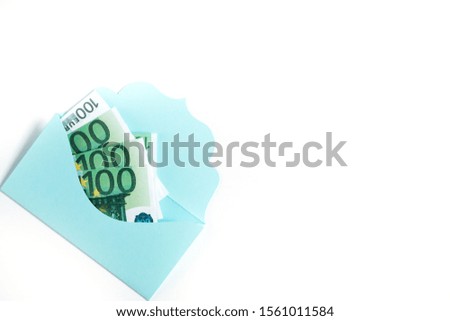 Communication, newsletter and business concept - blue envelope full of money on white background