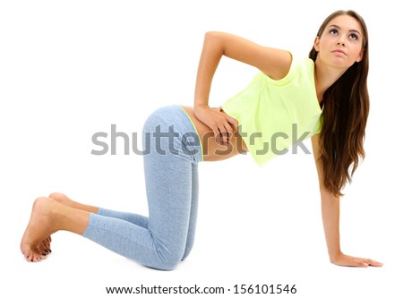Young beautiful fitness girl doing yoga exercise isolated on white