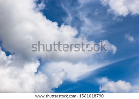 cumulus and high-cumulus clouds of an average tier on blue heavenly space