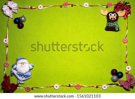 Christmas background. Light green background in a frame of red and white buttons, in the corners of santaclaus, deer and Christmas toys.
