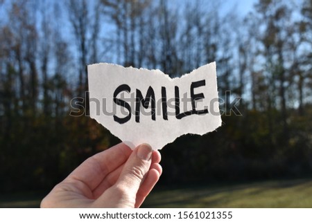 smile note on paper in nature
