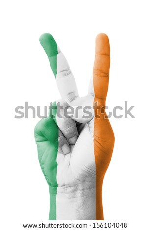 Hand making the V sign, Ireland flag painted as symbol of victory, win, success - isolated on white background