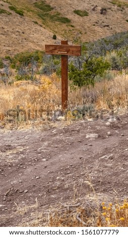 Vertical frame Signboard on a hiking trail in Utah wilderness