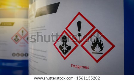 Chemical Barrels Tank with a warning label in Chemical factory Royalty-Free Stock Photo #1561135202