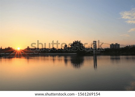 bridge with sunrise and lake