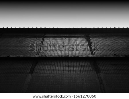 Black and white symmetrical building wall backdrop