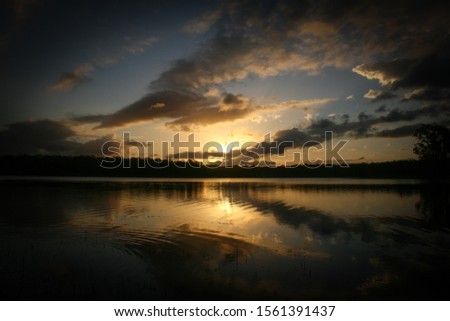 A picturesque view of Lake Kurwongbah as the sun is setting. This photo was taken in Brisbane, Australia. 