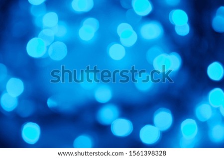 Abstract bokeh of light blue illuminations holidays background greeting card free space for your text