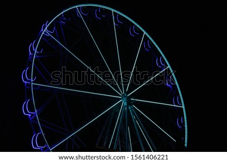 illuminated Ferris wheel at night