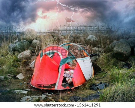 torn by a frantic hurricane wind, a cheap inexpensive tent suggests that it is important to buy high-quality branded equipment outdor in the mountains and travel. Shipwreck and severe thunderstorm 