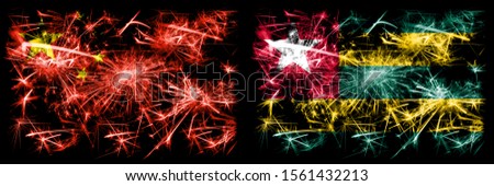 China, Chinese vs Togo, Togolese New Year celebration travel sparkling fireworks flags concept background. Combination of two abstract states flags.
