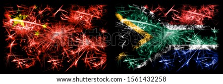 China, Chinese vs South Africa, African New Year celebration travel sparkling fireworks flags concept background. Combination of two abstract states flags.
