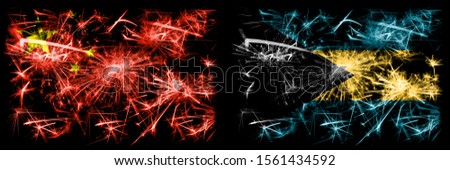 China, Chinese vs Bahamas, Bahamian New Year celebration travel sparkling fireworks flags concept background. Combination of two abstract states flags.

