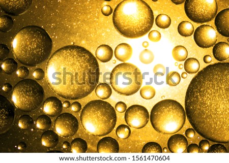 Blurred amber bubbles in the background