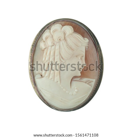 antique cameo brooch with a woman's portrait Royalty-Free Stock Photo #1561471108